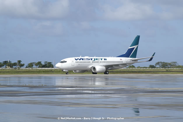 MBJ Airports Limited Welcomes WestJet Airlines - Inaugural Scheduled Service From Toronto Pearsons International Airport - Monday, December 10, 2007 - Sangster International Airport - MBJ Airports Limited, Montego Bay, Jamaica W.I. - Photographs by Net2Market.com - Barry J. Hough Sr, Photographer - Negril Travel Guide, Negril Jamaica WI - http://www.negriltravelguide.com - info@negriltravelguide.com...!